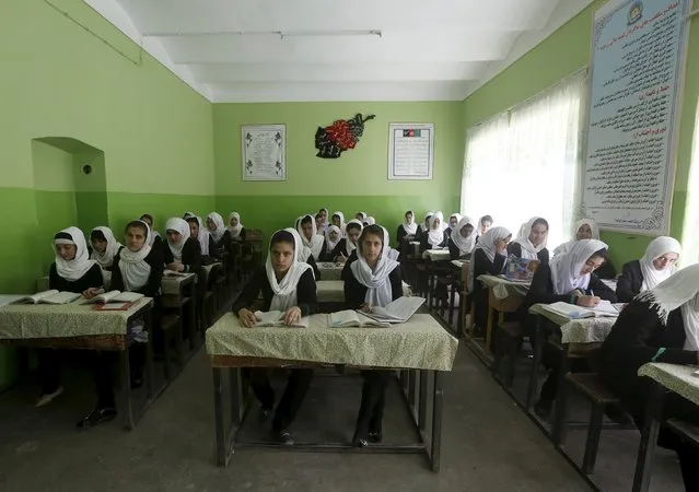 Class 11 Afghan girl students attend a class at Zarghona high school in Kabul, Afghanistan, August 15, 2015. (Photo by Omar Sobhani/Reuters)