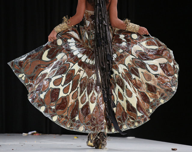 A model wears a creation made with chocolate during a fashion show at the inauguration of the 20th annual Salon du Chocolat in Paris on October 28, 2014. (Photo by David Silpa/UPI)