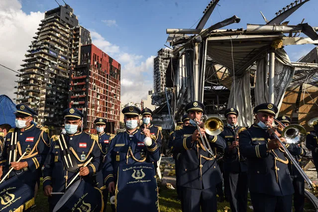 A scouts band performs in honor of the victims of the last week's explosion that killed over 150 people and devastated the city, near the blast site in Beirut, Lebanon, Tuesday, August 11, 2020. (Photo by Elizabeth Fitt/SIPA Press/Rex Features/Shutterstock)