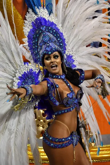 A reveller of the Rosas de Ouro samba school performs during the first night of carnival in Sao Paulo, Brazil, at the city' s Sambadrome early on February 10, 2018. (Photo by AFP Photo/Stringer)