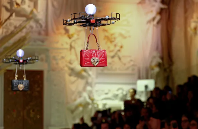 Drones carry bags, the creations from the Dolce & Gabbana Autumn/Winter 2018 women's collection during Milan Fashion Week in Milan, Italy February 25, 2018. (Photo by Alessandro Garofalo/Reuters)
