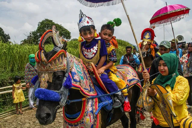 Children ride a “Dancing horse” also known as “Kuda Renggong” during the procession in Tanjungsari, Sumedang, Indonesia on November 9, 2020. The Dancing horse is one of the folk performing arts and culture from Sumedang. The word “renggong” comes from the word (“ronggeng” or “kamonesan” in the local Sundanese language) which means skill. The Horse has been trained with skills to dance to accompanying music, especially drums, which is usually used as a media ride in the procession of children circumcision. (Photo by Algi Febri Sugita/SOPA Images/Rex Features/Shutterstock)