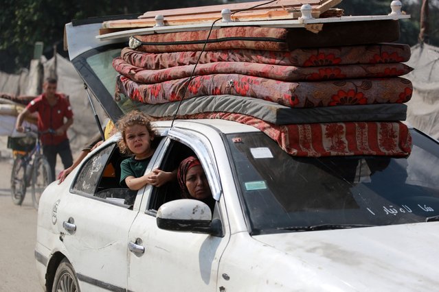 Palestinians flee with their belongings the Abu Iskandar neighbourhood of northern Gaza City on August 22, 2025. Israeli Defence Minister Israel Katz vowed on August 22 to destroy Gaza City if Hamas did not agree to disarm, release all remaining hostages in the territory and end the war on Israel's terms. (Photo by Bashar Taleb/AFP Photo)