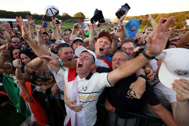 Rory McIlroy celebrates with fans after Team Europe's 15-13 win over Team America during the trophy presentation ceremony of the 2025 Ryder Cup in Farmingdale, New York, on Sunday, September 28, 2025. (Photo by Maddie Meyer/PGA of America/Getty Images)