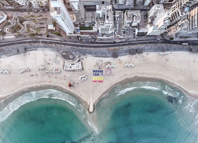 A drone view shows the words “WANNA SAVE?! SAVE! DON'T TALK!”, displayed by activists supporting the release of all hostages and ending the war, at the shore of the Mediterranean opposite the U.S. Consulate, in Tel Aviv, Israel, on September 5, 2025. (Photo by Aviv Atlas/Reuters)