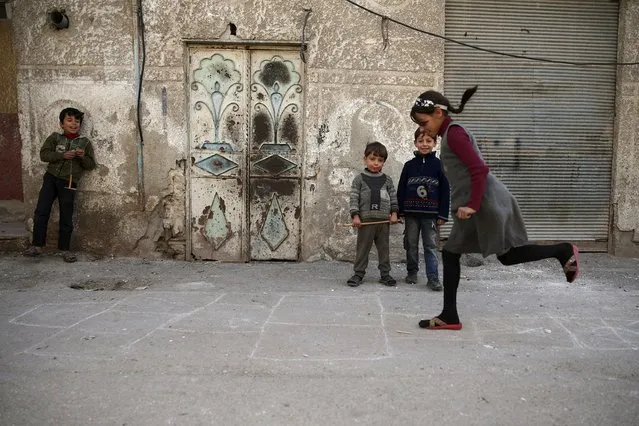Children play in the Douma neighborhood of Damascus, Syria November 26, 2015. (Photo by Bassam Khabieh/Reuters)