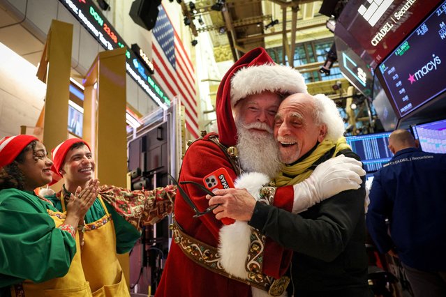 Macy's Santa Claus is greeted by traders on the floor at the New York Stock Exchange (NYSE) in New York City, U.S., November 26, 2025. (Photo by Brendan McDermid/Reuters)