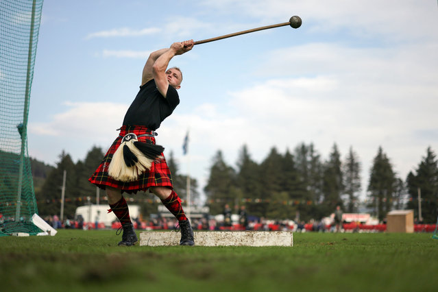 A Lonach Highlander throws the hammer during the Lonach Highland Gathering and Games on August 24, 2024 in Strathdon, Scotland. The event is organised by the the Lonach Highland and Friendly Society, which was founded 1823 by Sir Charles Forbes, 1st Baronet of Newe and Edinglassie. The group's members continue to fulfil the society's original mission of preserving Highland dress and “supporting loyal, peaceful, and manly conduct; and the promotion of social and benevolent feelings among the inhabitants of the district”. (Photo by Jeff J. Mitchell/Getty Images)
