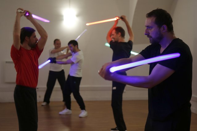 Members of the Sport Saber League practise light saber during a training session in Paris, France, November 10, 2015. (Photo by Charles Platiau/Reuters)