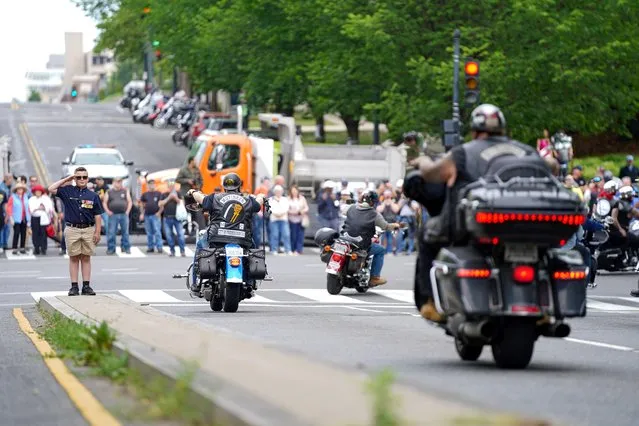 Jackson Leonard salutes during the “Rolling to Remember” motorcycle rally, successor to “Rolling Thunder” as it rides through to bring attention to issues faced by veterans, in Washington, U.S., May 28, 2023. (Photo by Bonnie Cash/Reuters)