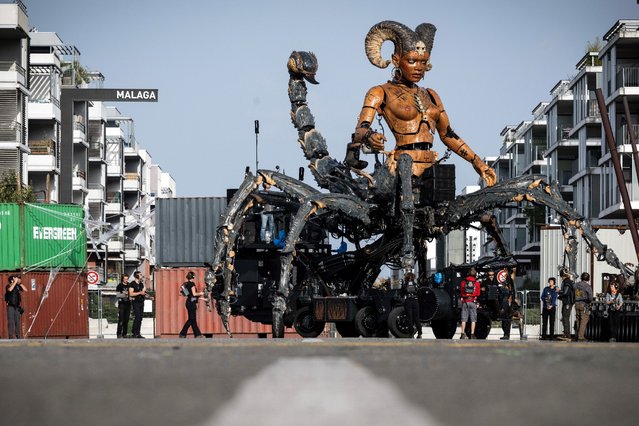 Operators work on Lilith, the guardian of darkness, built for the Hellfest metal festival, in Toulouse, southwestern France, on October 15, 2024. “Lilith” is one of the characters in the urban opera of the French company La Machine entitled “The Guardian of the Temple opus II: The Portal of Darkness”, which will be presented on October 25, 26 and 27 in Toulouse. This spectacle is considered dark, even diabolical by the Archbishop of Toulouse who will consecrate the city on October 16, 2024 to protect it. (Photo by Lionel Bonaventure/AFP Photo)