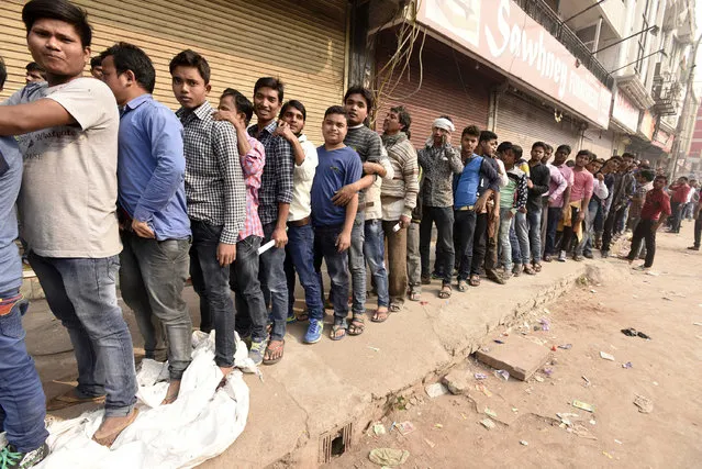 Heavy rush outside Oriental Bank of Commerce to replace 500 and 1,000 rupee notes after Central Government demonize the Indian currency of Rupees 500 and 1000 at Mahila Colony, on November 15, 2016, in New Delhi, India. As part of sweeping steps to battle black money, Prime Minister Narendra Modi announced that Rs. 500 and Rs. 1,000 currency notes will cease to be legal tender from midnight of Tuesday. (Photo by Sonu Mehta/Hindustan Times via Getty Images)