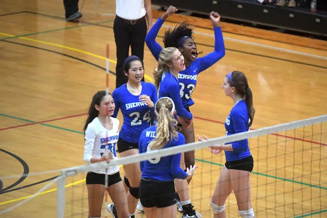 The Sherwood Warriors celebrate as they beat the Arundel Wildcats 25-20, 9-25, 21-25, 25-22, 15-13 to advance to the Maryland 4A state finals November, 16, 2016 in College Park, MD. (Photo by Katherine Frey/The Washington Post)