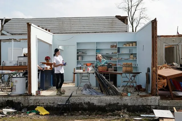 Kathy Poss (R) salvages items from Ragan Chapel United Methodist Church the day after a string of tornadoes caused several fatalities in Ohatchee, Alabama, U.S., March 26, 2021. (Photo by Elijah Nouvelage/Reuters)