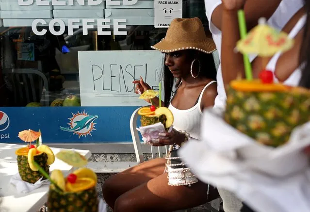 People enjoy the bars and restaurants on South Beach during Spring Break amid the coronavirus disease (COVID-19) pandemic, in Miami, Florida, U.S., March 27, 2021. (Photo by Yana Paskova/Reuters)