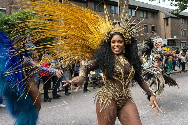 The grand finale of the Notting Hill Carnival, during which performers present their costumes and dance to the rhythms of the mobile sound systems or steel bands along the streets of West London, UK on August 27, 2018. Hundreds of thousands revellers are expected to take part in Notting Hill Carnival. (Photo by Wiktor Szymanowicz/Barcroft Media via Getty Images)