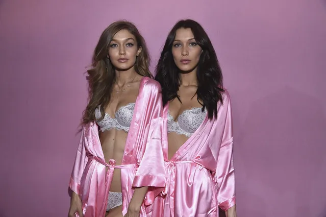 (L-R) Gigi Hadid and Bella Hadid pose backstage prior to the Victoria's Secret Fashion Show on November 30, 2016 in Paris, France. (Photo by Pascal Le Segretain/Getty Images for Victoria's Secret)