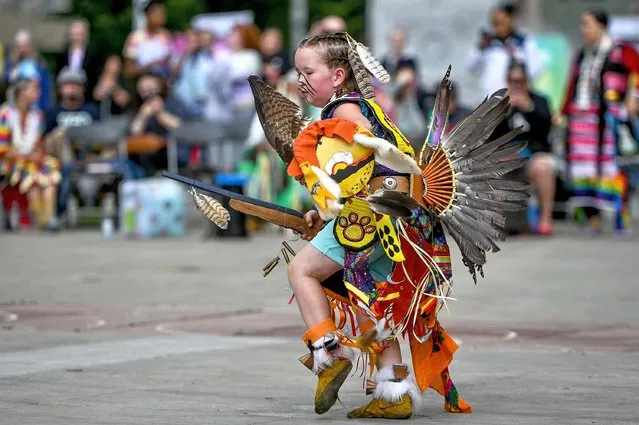 A young danceur performing a dance during the Beaver Hills 2Spirit Powwow in Edmonton's Churchill Square on the opening day of the Edmonton Pride Festival, on August 24, 2023, in Edmonton, Alberta, Canada. (Photo by Artur Widak/NurPhoto/Rex Features/Shutterstock)