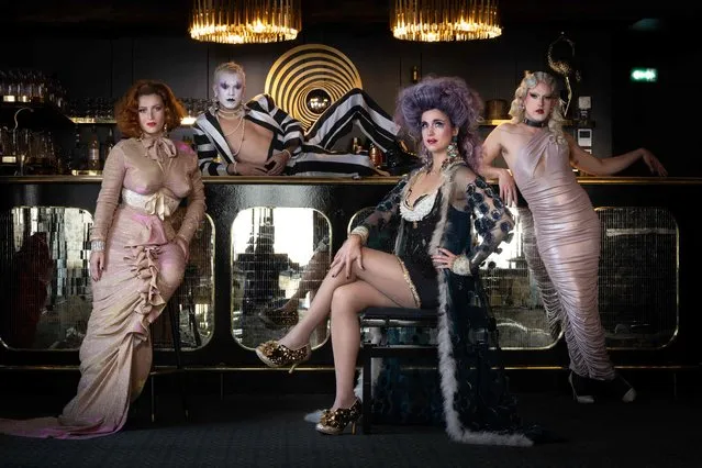 French artists Maud'Amour, Grand Soir, Odile De Mainville and Diamanda Callas, members of the transformist Cabaret Madame Arthur, poses at the Cabaret in Paris on September 29, 2023. Open since 1946 Madame Arthur is the oldest transformist cabaret in Paris. Threatened with extinction the cabaret is undergoing a renaissance, attracting younger customers by returning to the fundamentals of the lie: baroque and queer performers who play with genres and conventions, and sing French hits live. (Photo by Joel Saget/AFP Photo)