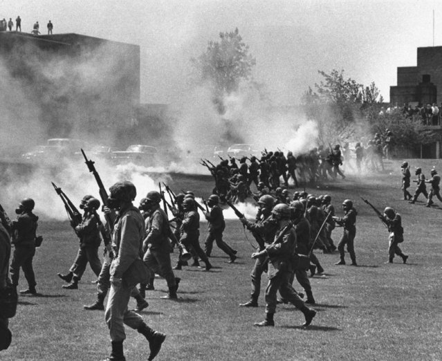 In a May 4, 1970 file photo, Ohio National Guard moves in on rioting students at Kent State University in Kent, Ohio. Four persons were killed and eleven wounded when National Guardsmen opened fire. The U.S. Justice Department, citing “insurmountable legal and evidentiary barriers”, won't reopen its investigation into the deadly 1970 shootings by Ohio National Guardsmen during a Vietnam War protest at Kent State University. Assistant Attorney General Thomas Perez discussed the obstacles in a letter to Alan Canfora, a wounded student who requested that the investigation be reopened. The Justice Department said Tuesday, April 24, 2012 it would not comment beyond the letter. (Photo by AP Photo)