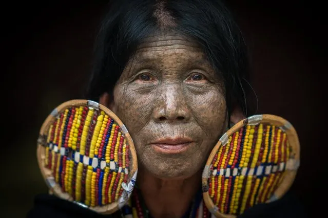 Woman of the Chin tribe showsoff her face tattoos in, Mindat, Myanmar, November 2016. In the mountains of Myanmar lives a tribe where the women have taken a unique approach to their beauty regime by decorating their faces with tattoos. The Chin people in the remote mountain town of Mindat, have been marking women in the area with intricate face tattoos for centuries. With a variety of styles and designs the detailed markings have a deep rooted cultural significance to the largely christian community. Photographer and cyber security expert, Teh Han Lin took the intimate pictures on a recent trip to Myanmar. (Photo by Teh Han Lin/Barcroft Images)