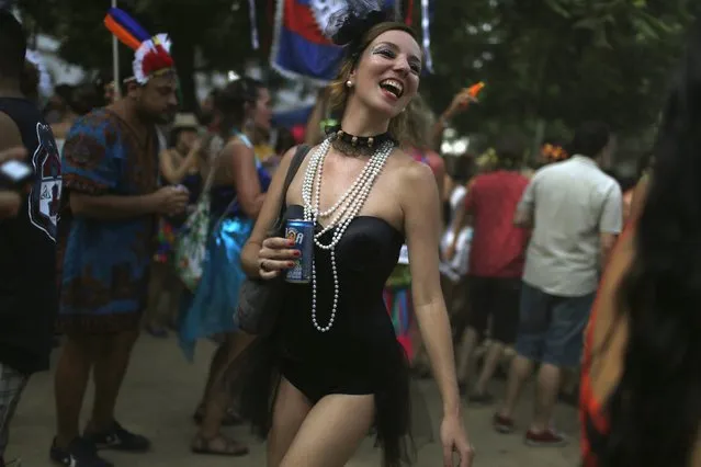 A reveller takes part in an annual block party known as “Cordao de Prata Preta”, one of the many carnival parties to take place in the neighbourhoods of Rio de Janeiro, February 6, 2016. (Photo by Pilar Olivares/Reuters)