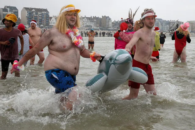 People wearing costumes participate in a traditional New Year's Day swim in Dunkirk, France January 1, 2017. (Photo by Pascal Rossignol/Reuters)
