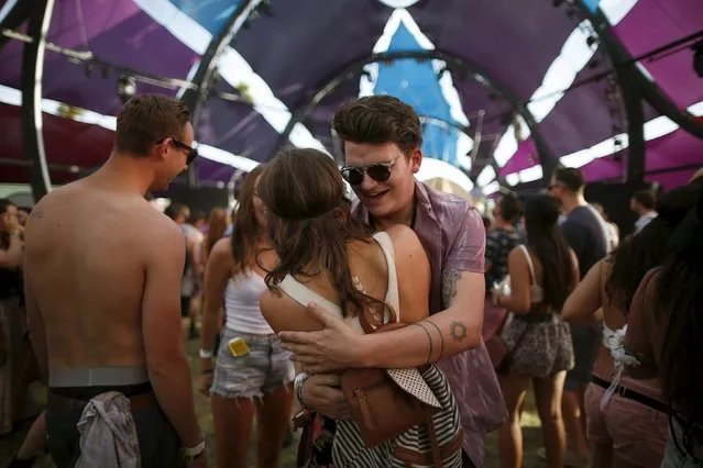 A couple dances at the Coachella Valley Music and Arts Festival in Indio, California April 10, 2015. (Photo by Lucy Nicholson/Reuters)