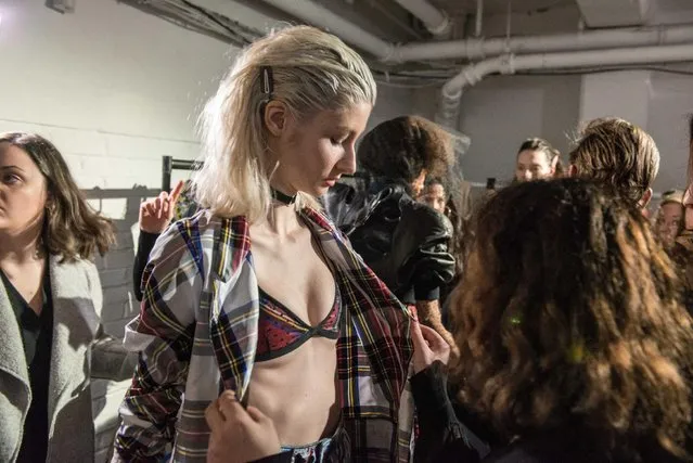 Models are put into their outfits backstage at the punk themed “On|Off Presents Punk Diversity” fashion show during London Fashion Week on February 19, 2016 in London, England. (Photo by Chris Ratcliffe/Getty Images)