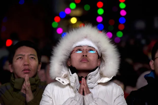 Chinese catholics attend a Christmas Eve Mass service at the official Catholic church South Cathedral in Beijing, China, Tuesday, Dec. 24, 2013. China and the Vatican have no diplomatic ties and the ruling Communist Party forced Chinese Catholics to sever their ties in the 1950s. China officially records about 6 million Catholics worshipping in 6,300 congregations across the country, although millions more are believed to worship outside the official church, with considerable crossover between the two in many areas. (Photo by Ng Han Guan/AP Photo)