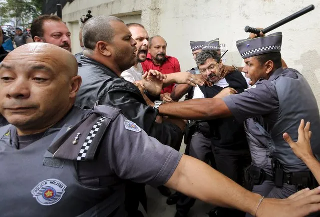 Supporters of former Brazilian president Luiz Inacio Lula da Silva confront police officers during a protest in front of Lula's apartment in Sao Bernardo do Campo, Brazil March 4, 2016. (Photo by Paulo Whitaker/Reuters)