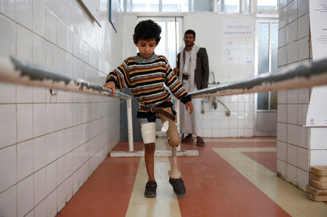 A young boy who lost his leg in the Yemen war uses a prosthetic limb at a government-run rehabilitation center in Sanaa, Yemen, Saturday, March 5, 2016. Yemen's conflict pits the government, backed by the Saudi-led coalition, against Shiite rebels known as Houthis allied with a former president. Yemen's war has killed at least 6,200 civilians and injured tens of thousands of Yemenis, and 2.4 million people have been displaced, according to U.N. figures. (Photo by Hani Mohammed/AP Photo)