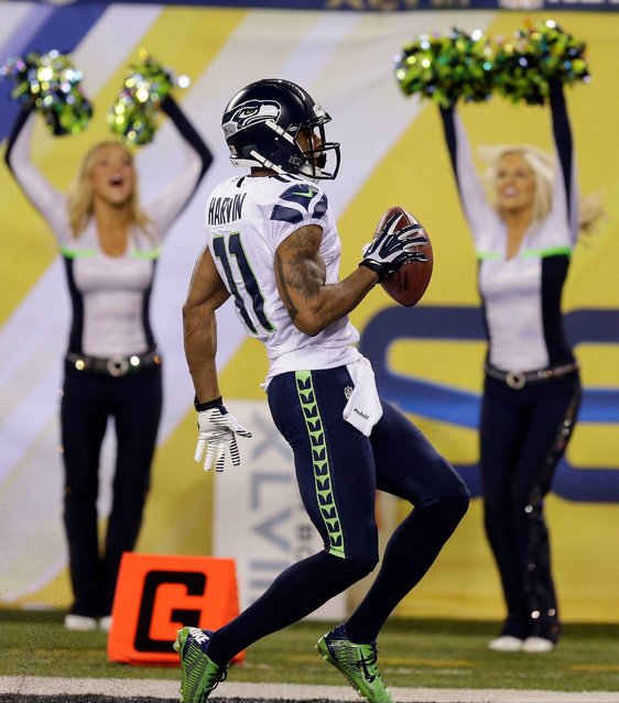 Seattle Seahawks' Percy Harvin celebrates after a touchdown against the Denver Broncos during the second half of the NFL Super Bowl XLVIII football game Sunday, February 2, 2014, in East Rutherford, N.J. (Photo by Ben Margot/AP Photo)