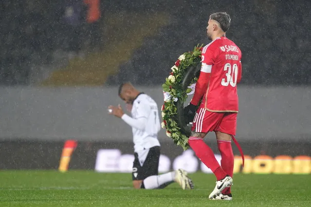 Benfica pay hommage to the team's late soccer player Miklos Feher before the Liga Portugal match between Vitoria de Guimaraes and Benfica SL, held at Afono Henriques stadium in Guimaraes, Portugal, 11 February 2024. (Photo by Hugo Delgado/EPA)