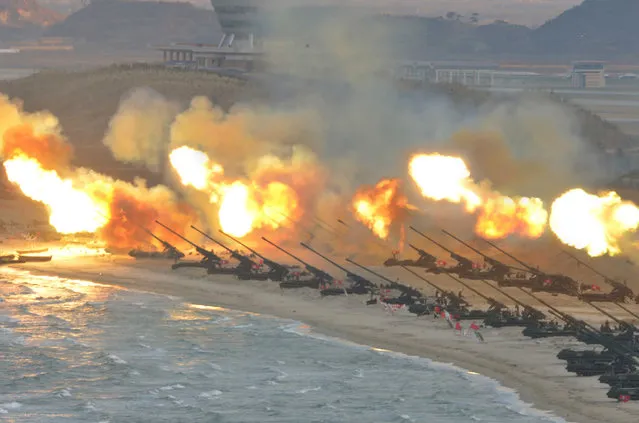 This undated picture released from North Korea's official Korean Central News Agency (KCNA) on March 25, 2016, shows the large-scale intensive striking drill of long-range artillery pieces of the KPA large combined units at an undisclosed location in North Korea. (Photo by AFP Photo/KCNA)