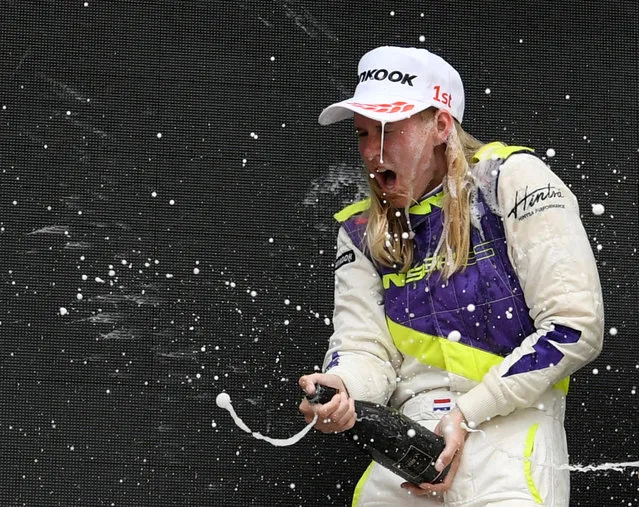 Netherlands' Beitske Visser celebrates after winning the race during the W Series championship at Circuit Terlamen Zolder on May 18, 2019 in Heusden-Zolder, Belgium. W Series is an all-female single-seater racing championship which aims to give female drivers an opportunity in motorsport that hasn’t been available to them before. The race of the series encompasses six rounds on the DTM or Deutsche Tourenwagen Masters support program. (Photo by Piroschka Van De Wouw/Reuters)