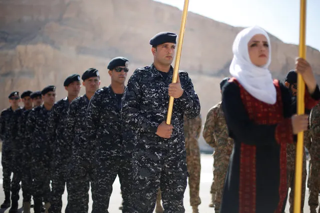 Members of the Jordanian police team stand to attention during the opening ceremony of eighth annual Warrior Competition at the King Abdullah Special Operations Training Center (KASOTC) in Amman, Jordan, May 2, 2016. (Photo by Muhammad Hamed/Reuters)