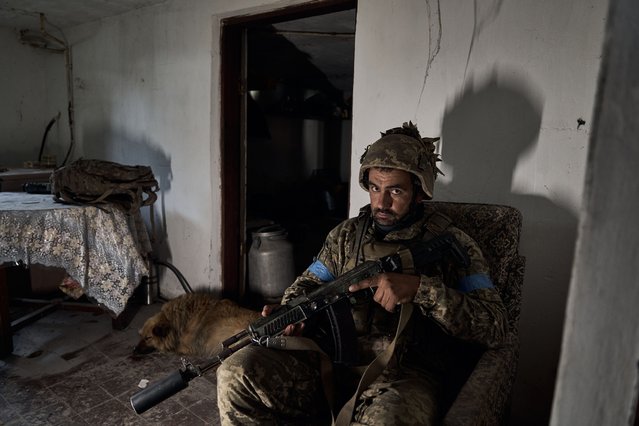 A Ukrainian soldier assumes position as the assault brigade defend the frontline in the Ukrainian boarder city of Vovchansk, in Chuhuiv Raion, Kharkiv Oblast, which is bombarded daily by heavy artillery on May 20, 2024 in Vovchansk, Ukraine. In recent days, Russian forces have gained ground in the Kharkiv region, an area that Ukraine had largely reclaimed in the months following Russia's initial large-scale invasion in February 2022.(Photo by Kostiantyn Liberov/Libkos/Getty Images)