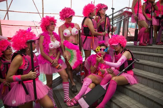 A team of dragon boat racers prepares for a fancy dress race on July 5, 2015 in Hong Kong, Hong Kong. (Photo by Taylor Weidman/Getty Images for Hong Kong Images)