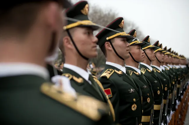 Paramilitary guards line up and prepare ahead of a welcoming ceremony for Norway's Prime Minister Erna Solberg at the Great Hall of the People in Beijing on April 7, 2017. (Photo by Nicolas Asfouri/AFP Photo)