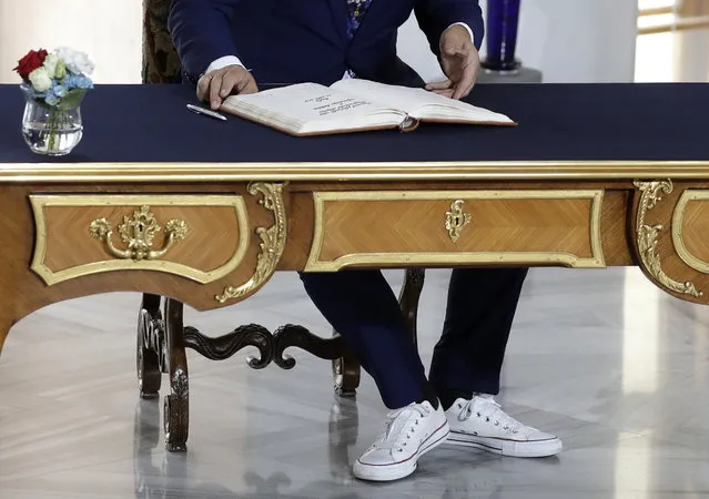 Albanian Prime Minister Edi Rama, wearing sport shoes, signs into a book upon his arrival for the V4+West Balkan summit in Prague, Czech Republic, Thursday, September 12, 2019. (Photo by Petr David Josek/AP Photo)