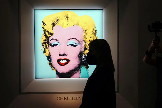 Andy Warhol's “Shot Sage Blue Marilyn”, a painting of Marilyn Monroe, is pictured on display at Christie's Auction House in advance of the piece going up for auction in the Manhattan borough of New York City, New York, U.S., March 21, 2022. (Photo by Carlo Allegri/Reuters)