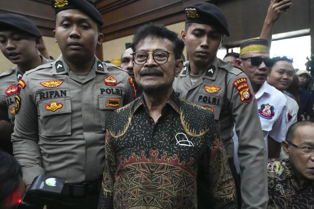 Former Indonesian Agriculture Minister Syahrul Yasin Limpo, center, is escorted by police officers upon arrival for his sentencing hearing on a corruption case at the Corruption Court in Jakarta, Indonesia Thursday, July 11, 2024. Indonesia’s anti-graft court sentenced the former agriculture minister to 10 years in prison Thursday after finding him guilty of corruption-related extortion, abuse of power and bribery involving ministry contracts with private vendors. (Photo by Tatan Syuflana/AP Photo)