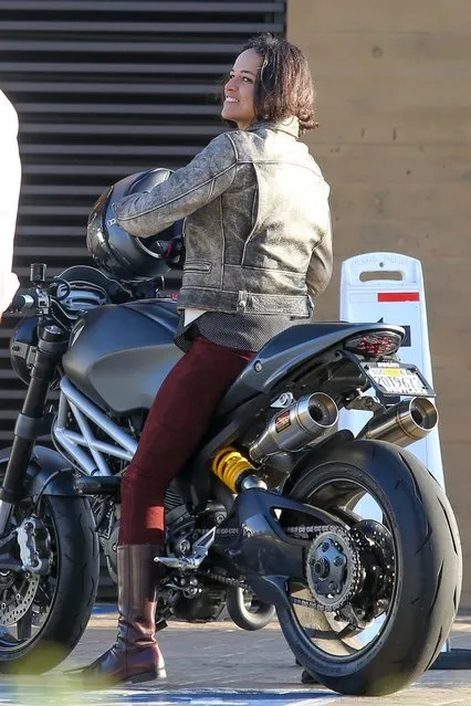 Fast & Furious actress Michelle Rodriguez says her goodbyes after riding her motorcycle to lunch with a friend at Nobu in Malibu, CA on November 12, 2019. (Photo by Backgrid USA)