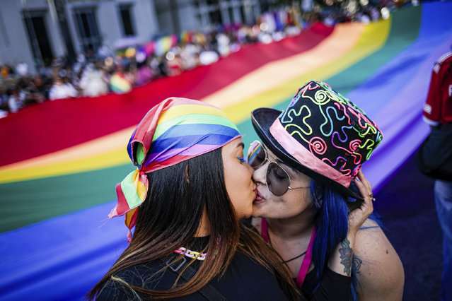 Participants kiss during the annual Gay Pride Parade in Sao Paulo, Brazil, Sunday, June 11, 2023. (Photo by Tuane Fernandes/AP Photo)