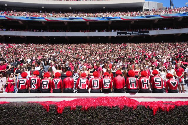 Fans observe a moment of silence for victims of Wednesday's school shooting at Apalachee High School before an NCAA college football game between Tennessee Tech and Georgia Saturday, September 7, 2024, in Athens, Ga. (Photo by John Bazemore/AP Photo)