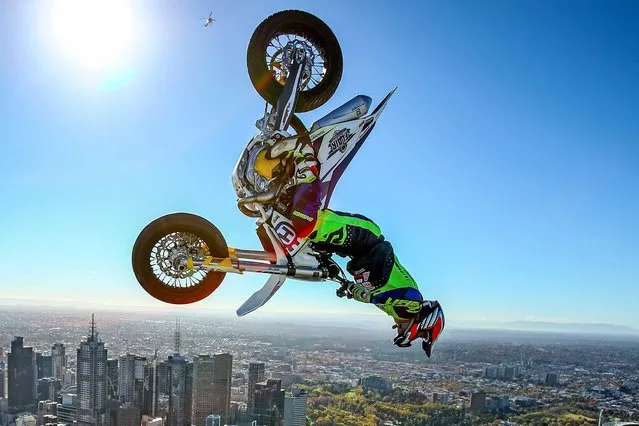 World Champion Trials bike rider Jack Field of Australia poses after performing the highest backflip on a motorcycle ever recorded as he flips his motorbike upside down on the roof of Melbourne's Eureka Tower (297.3 metres) during a AUS-X Open media opportunity at Eureka Tower on May 22, 2019 in Melbourne, Australia. The largest international Supercross and action sports event in the world outside of the USA, the AUS-X Open will be held at Melbourne's Marvel Stadium on November 30 2019. (Photo by Scott Barbour/Getty Images)