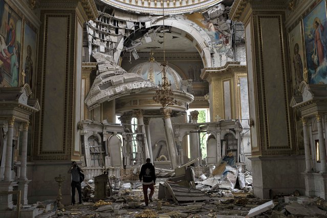 Church personnel inspect damages inside the Odesa Transfiguration Cathedral in Odesa, Ukraine, Sunday, July 23, 2023, following Russian missile attacks. (Photo by Jae C. Hong/AP Photo)