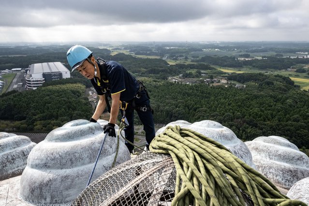 Cleaner Kazuyoshi Taguchi cleans the head section of the Ushiku Daibutsu giant Buddha statue in Ushiku of Ibaraki Prefecture on September 9, 2024. The 120-metre giant Buddha statue which stands northeast of Tokyo on Monday received an annual “soot removal” by veteran cleaners of more than 20 years. (Photo by Philip Fong/AFP Photo)