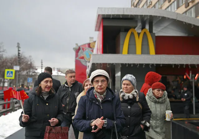 Customers outside a McDonald's restaurant in Pushkin Square in Moscow, Russia on January 31, 2020 – the first to have opened in the Soviet Union, celebrating its 30th birthday. (Photo by Sergei Bobylev/TASS)